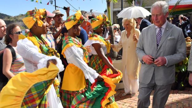 Prince Charles and Camilla visit a market during their visit to Grenada